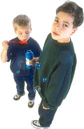 boys playing with bubbles